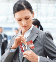 Woman putting on a visitor badge